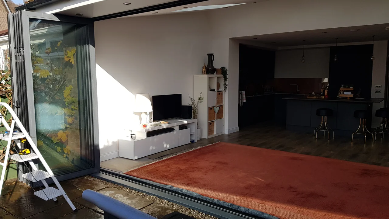 A garden-facing OpenGlide installation with individually positioned door panels