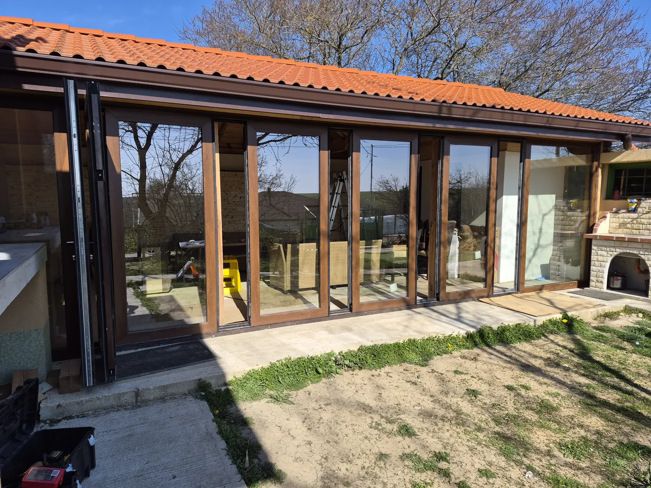 Individual panels positioned along the wood-effect frontage.