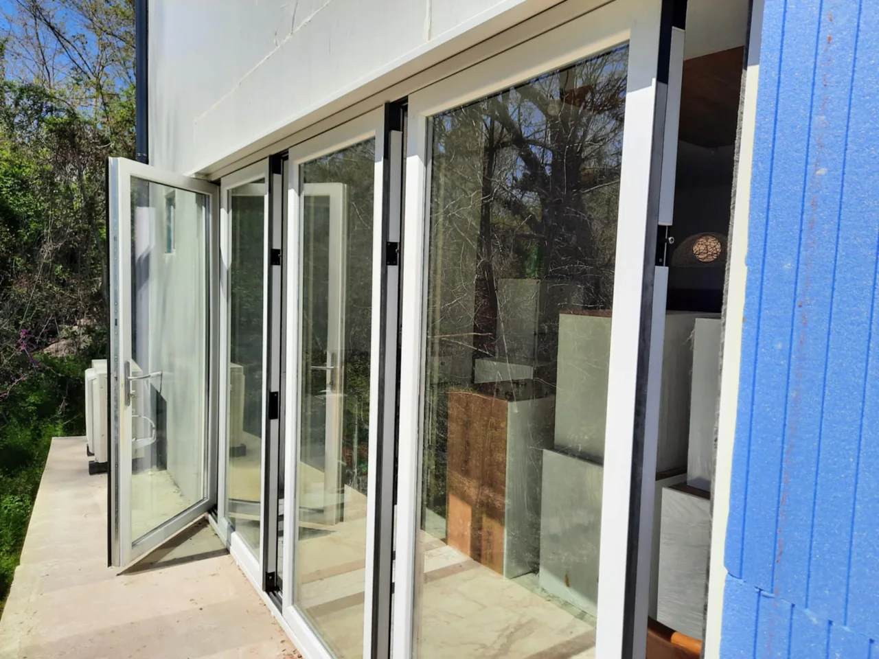 White OpenGlide profiles and individually opening glazed panels